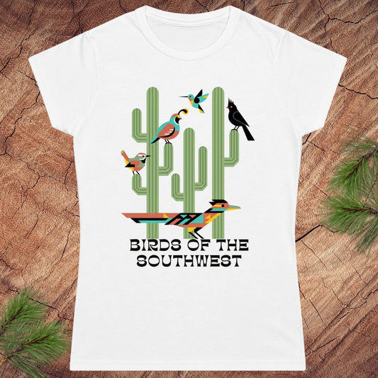 White t-shirt with 'Birds of the Southwest' design featuring cacti and birds on a wooden surface.
