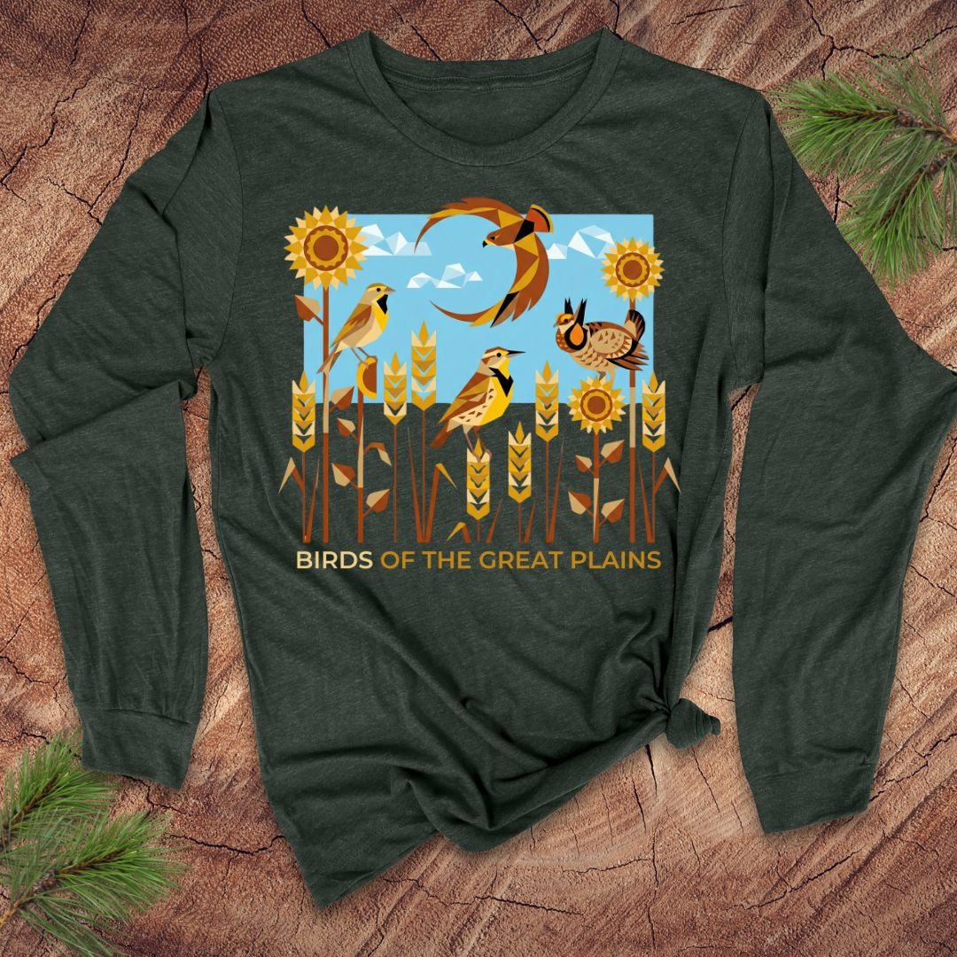 Green long-sleeve shirt with 'Birds of the Great Plains' design on a wooden surface.