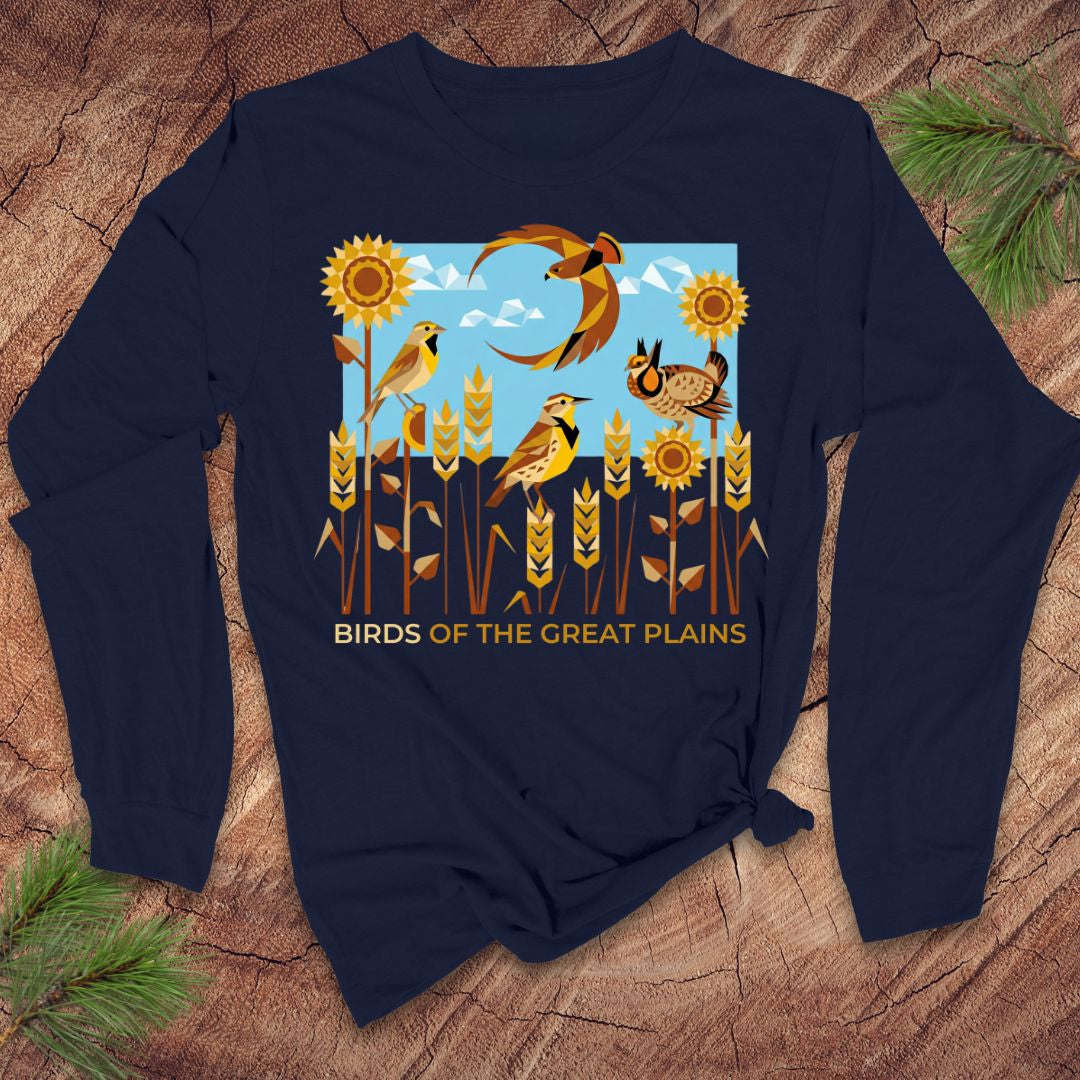 Navy blue long-sleeve shirt with 'Birds of the Great Plains' design on a wooden surface.