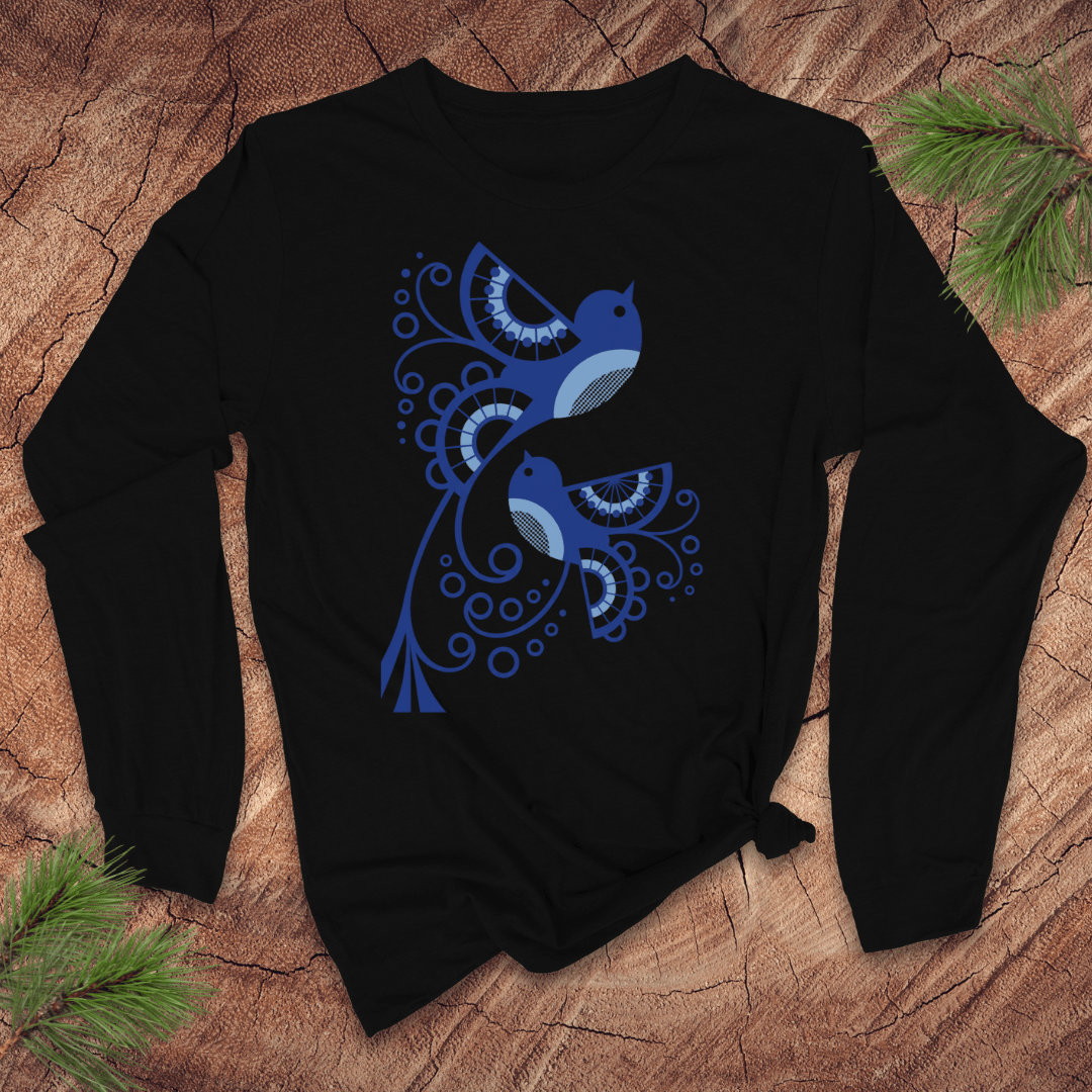 Black long sleeve tshirt with abstract blue bird design on a wooden surface
