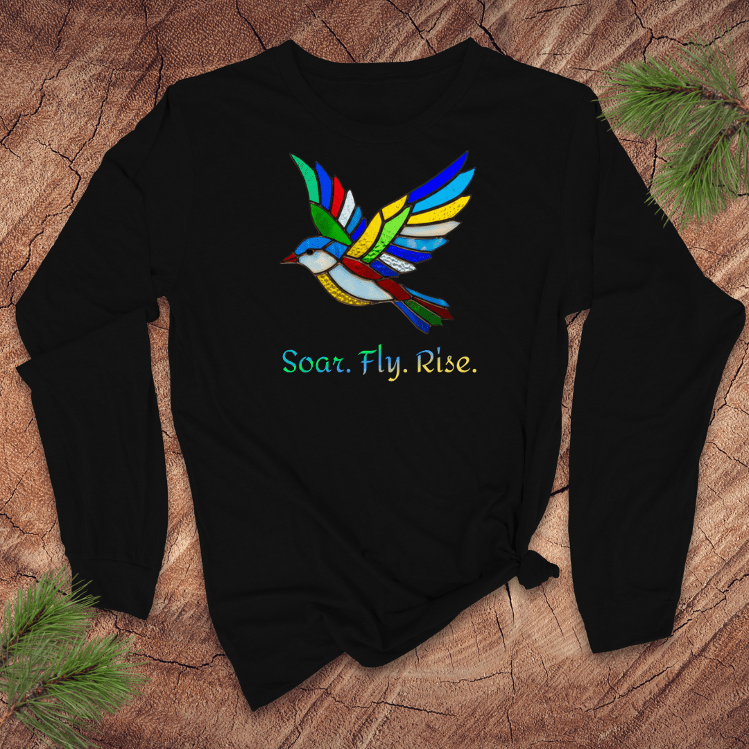 Black long sleeve tshirt with a colorful bird design and 'Soar. Fly. Rise.' text on a textured brown background.