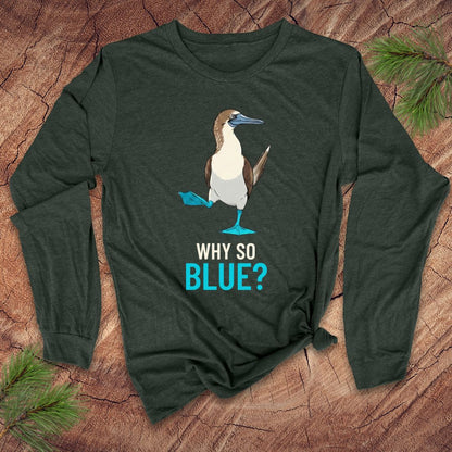 Green long-sleeve shirt with a blue-footed booby bird graphic and 'Why So Blue?' text on a wooden surface.