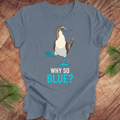 Steel blue t-shirt with a blue booby graphic and 'Why So Blue?' text on a wooden surface.