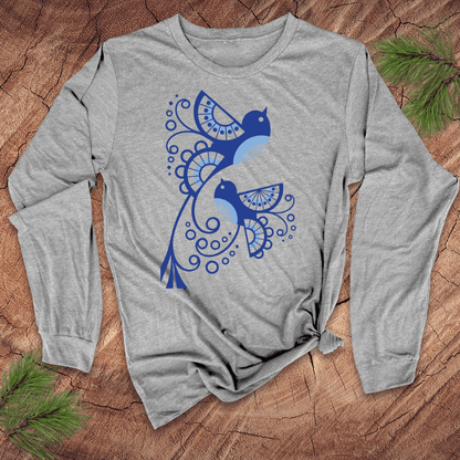 Gray long-sleeve shirt with abstract blue bird design on a wooden surface