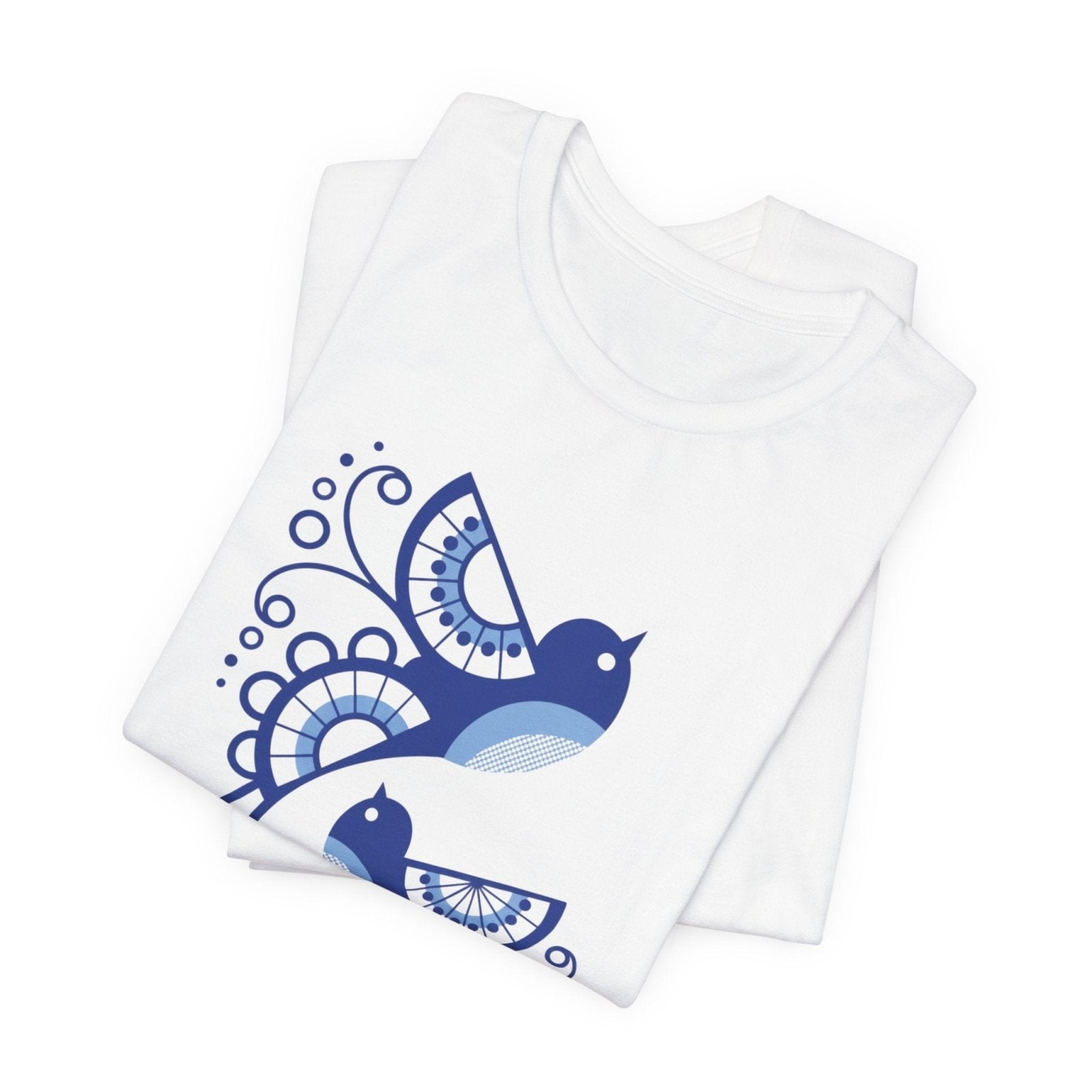 White folded tshirt with blue bird design on a white background