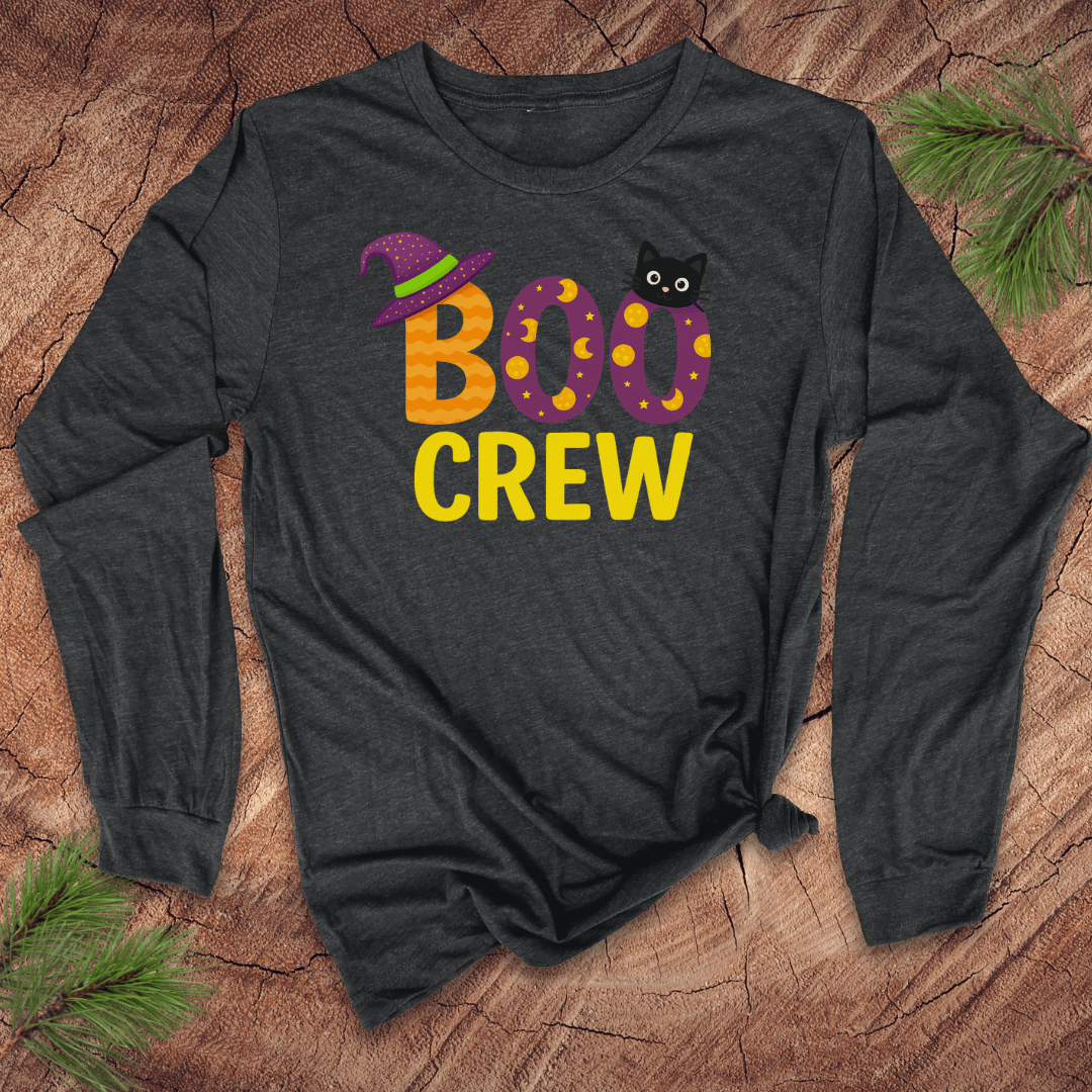 Dark long-sleeve shirt with 'BOO CREW' text and Halloween graphics on a wooden surface.