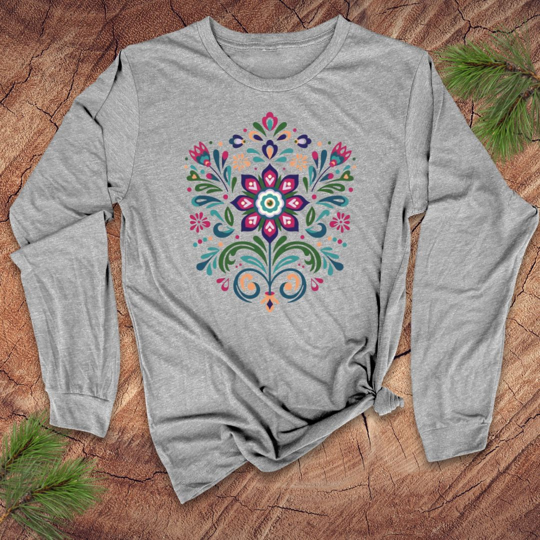 Grey long-sleeve t-shirt with a vibrant dutch inspired flower design on a wood background.