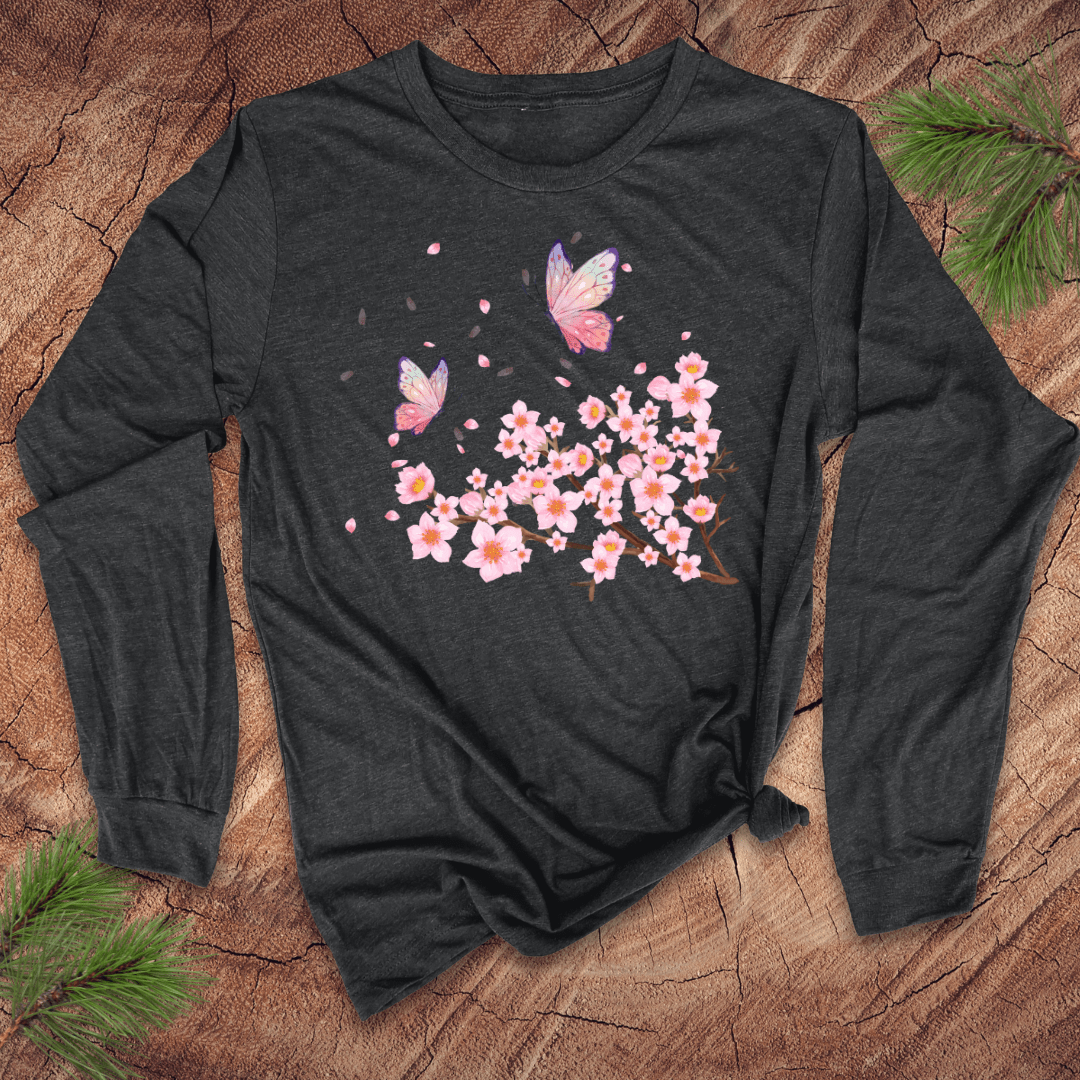 Dark long-sleeve shirt with butterfly and cherry blossom design on a wooden surface