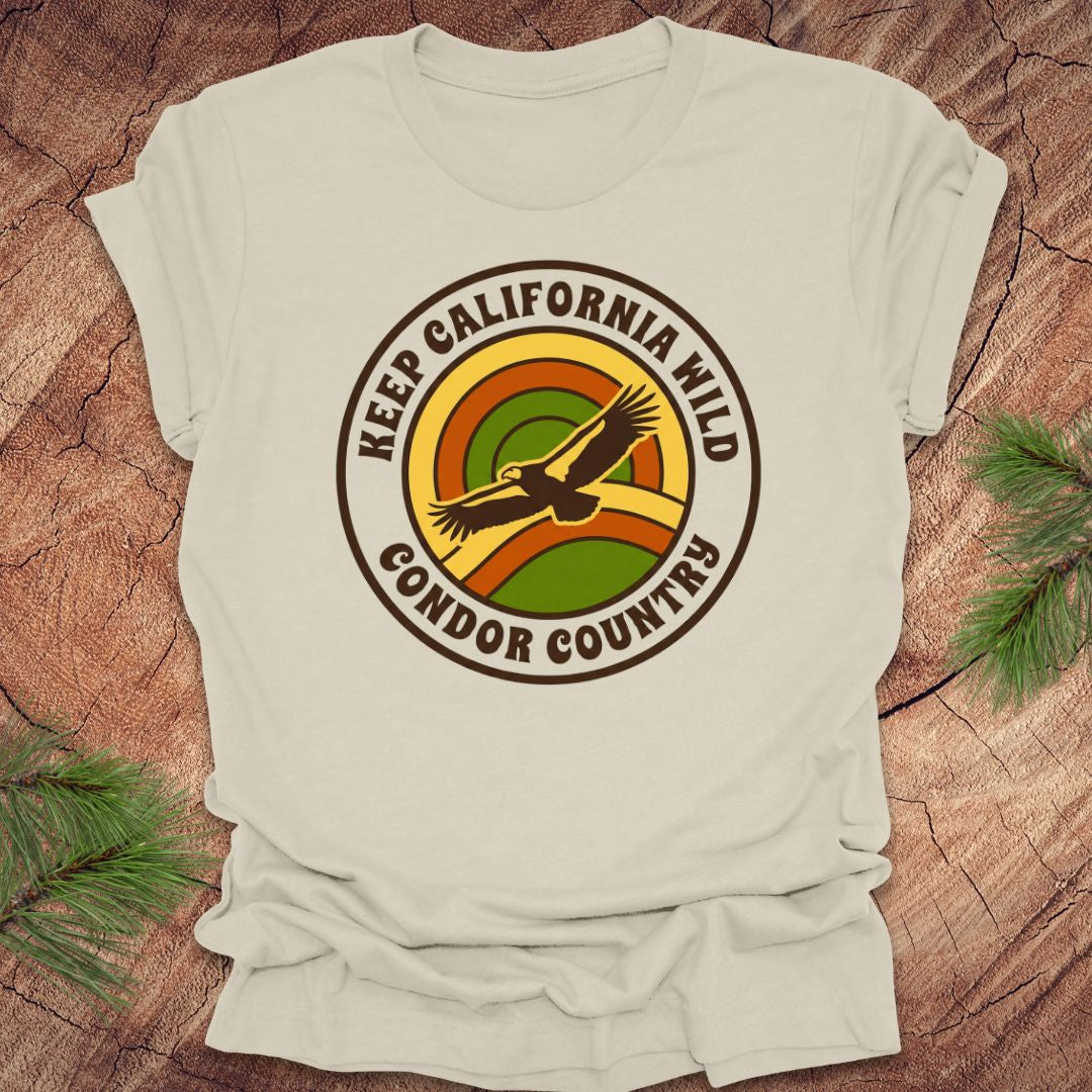 Beige t-shirt with 'Keep California Wild Condor Country' graphic on a wooden surface.
