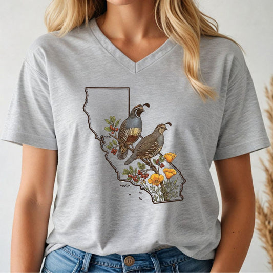 Person wearing a gray t-shirt with a graphic design of California, birds, and flowers.