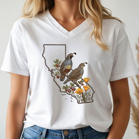 Person wearing a white t-shirt with a graphic design of California, quails, and flowers.