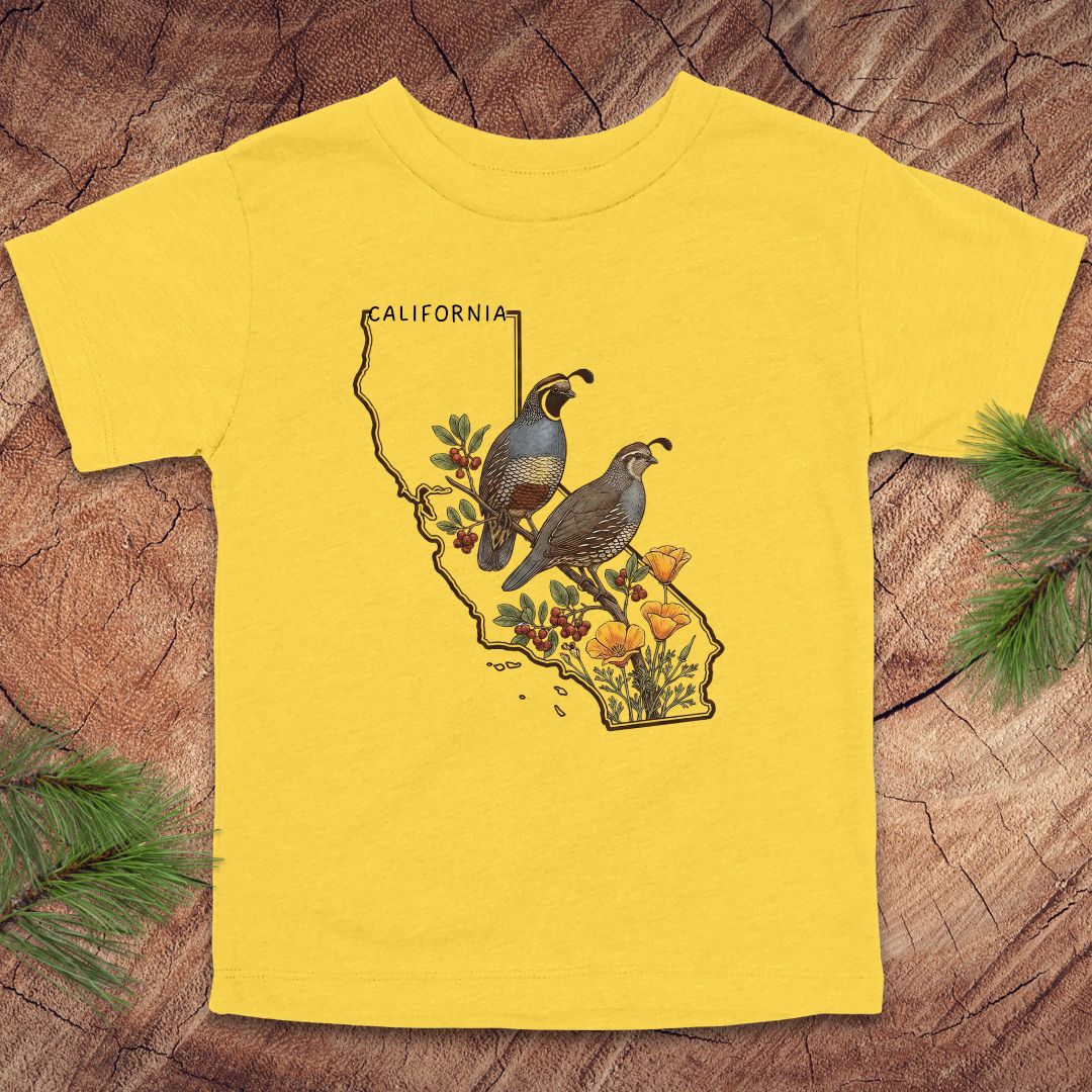 Yellow toddler t-shirt with state outline of California and quails and flowers on a wood background.