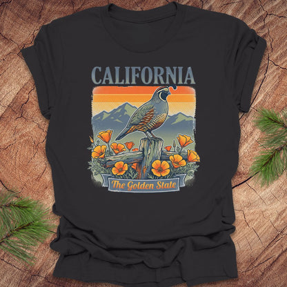 Black t-shirt with California-themed graphic featuring a bird and flowers on a wooden surface.