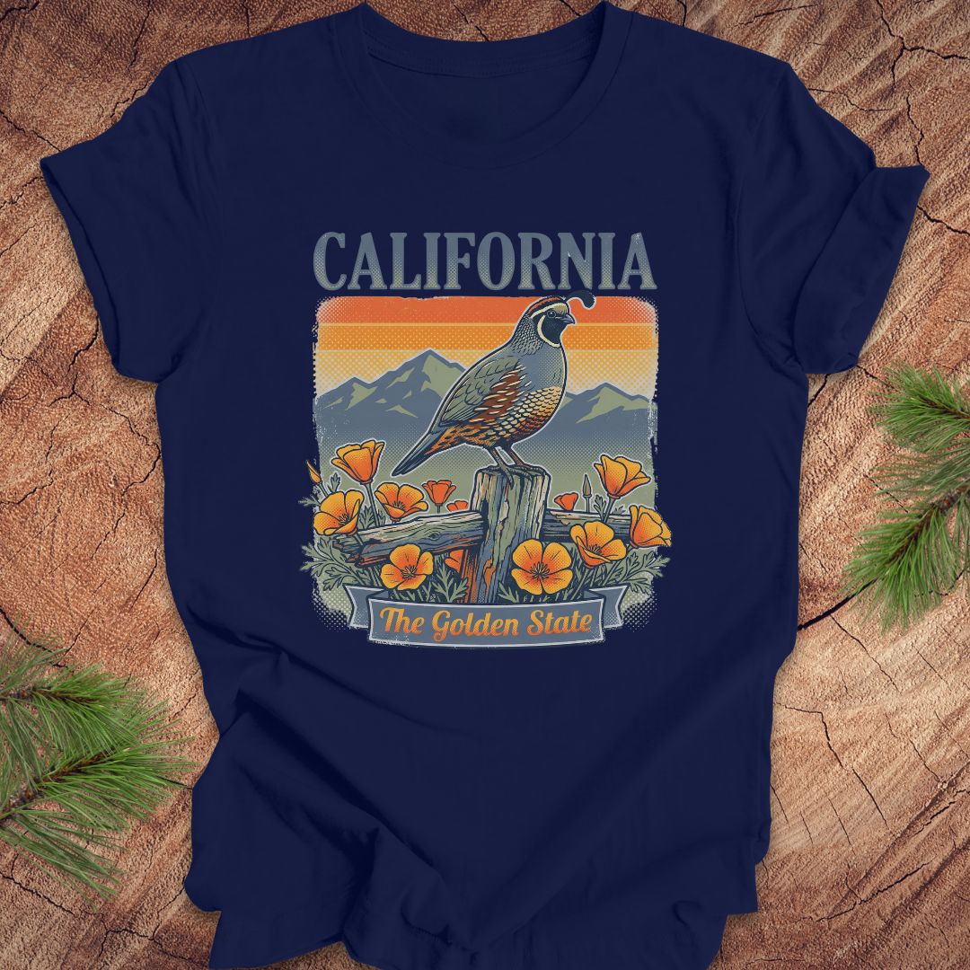 Navy blue t-shirt with California-themed graphic on a wooden surface