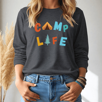 Person wearing a dark gray long sleeve tshirt with 'CAMP LIFE' text and graphics, standing against a neutral background.