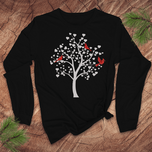 Black long-sleeve t-shirt with a white tree design featuring cardinals on a wooden surface.