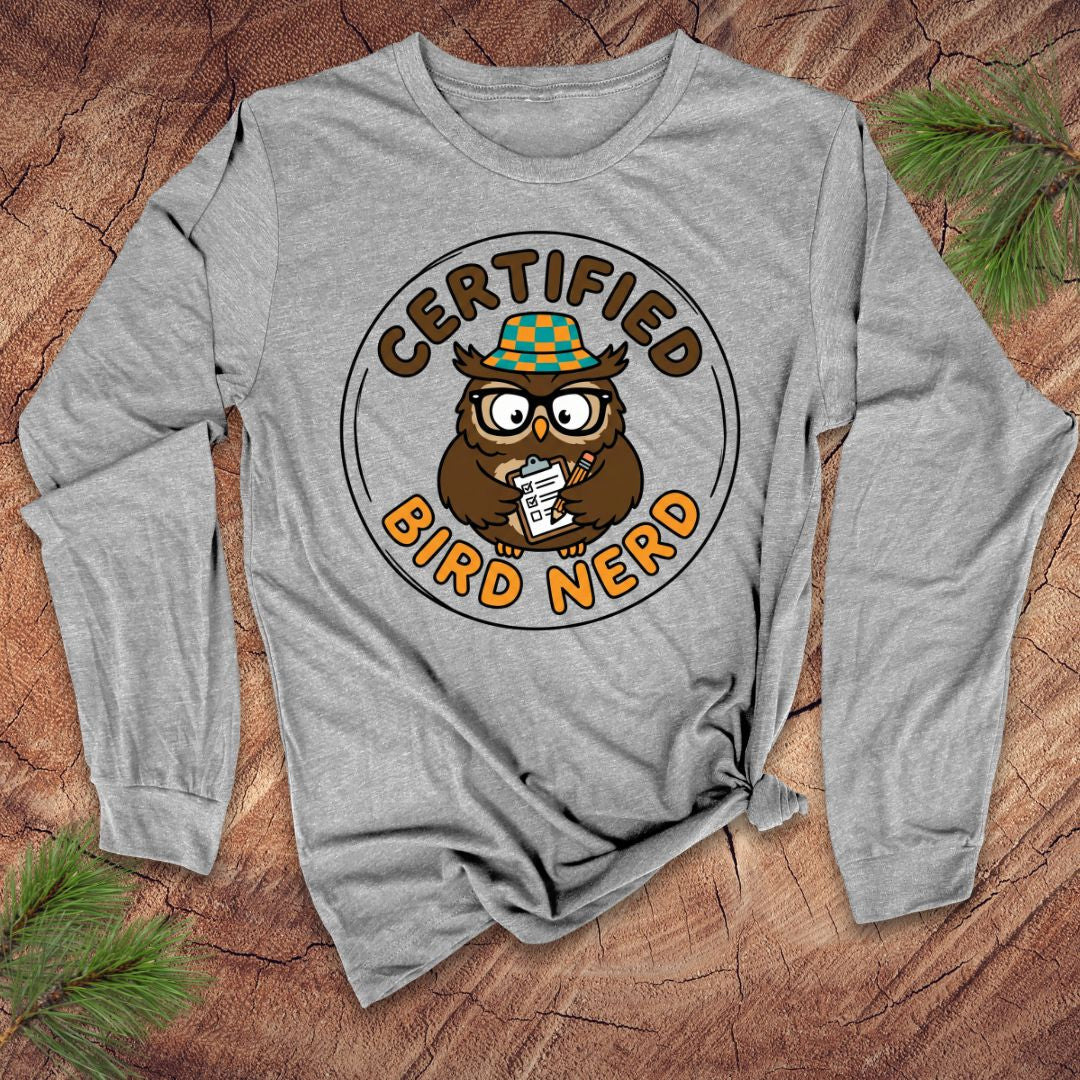 Gray long-sleeve shirt with owl graphic and 'Certified Bird Nerd' text on a wooden surface.