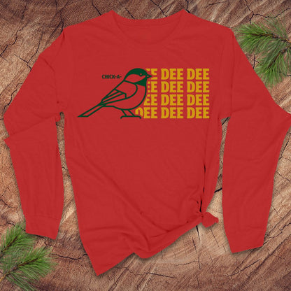 Red long-sleeve shirt with a chickadee graphic and 'DEE DEE DEE' text on a wooden surface.