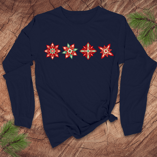 Navy blue long-sleeve shirt with red poinsettia designs on a wooden surface