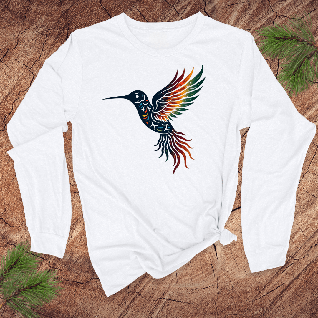 White long-sleeve shirt with a colorful hummingbird design on a wooden surface.