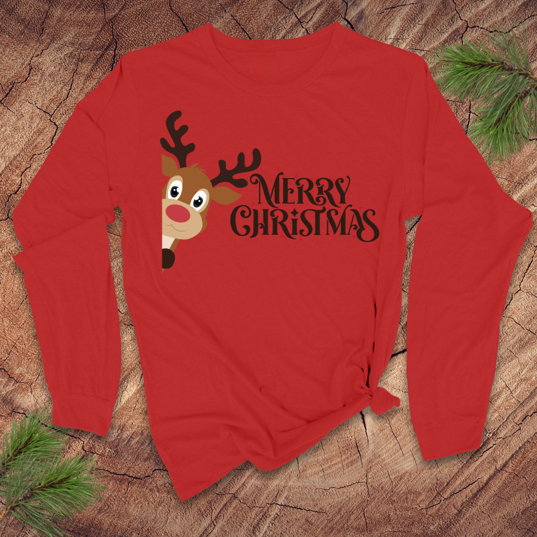 Red long-sleeve shirt with a reindeer and 'Merry Christmas' text on a wooden surface.