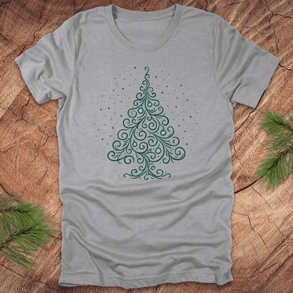 Gray t-shirt with a green Christmas tree design on a wooden surface