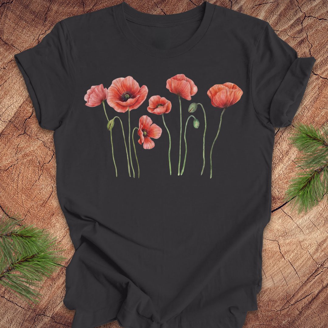 Dark gray t-shirt with individual poppy flowers on a wood background.