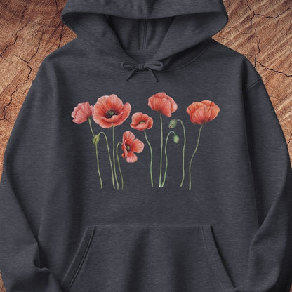 A dark heather gray hoodie featuring a graphic print of five red poppy flowers with green stems on the chest, displayed flat against a textured brown wood background.