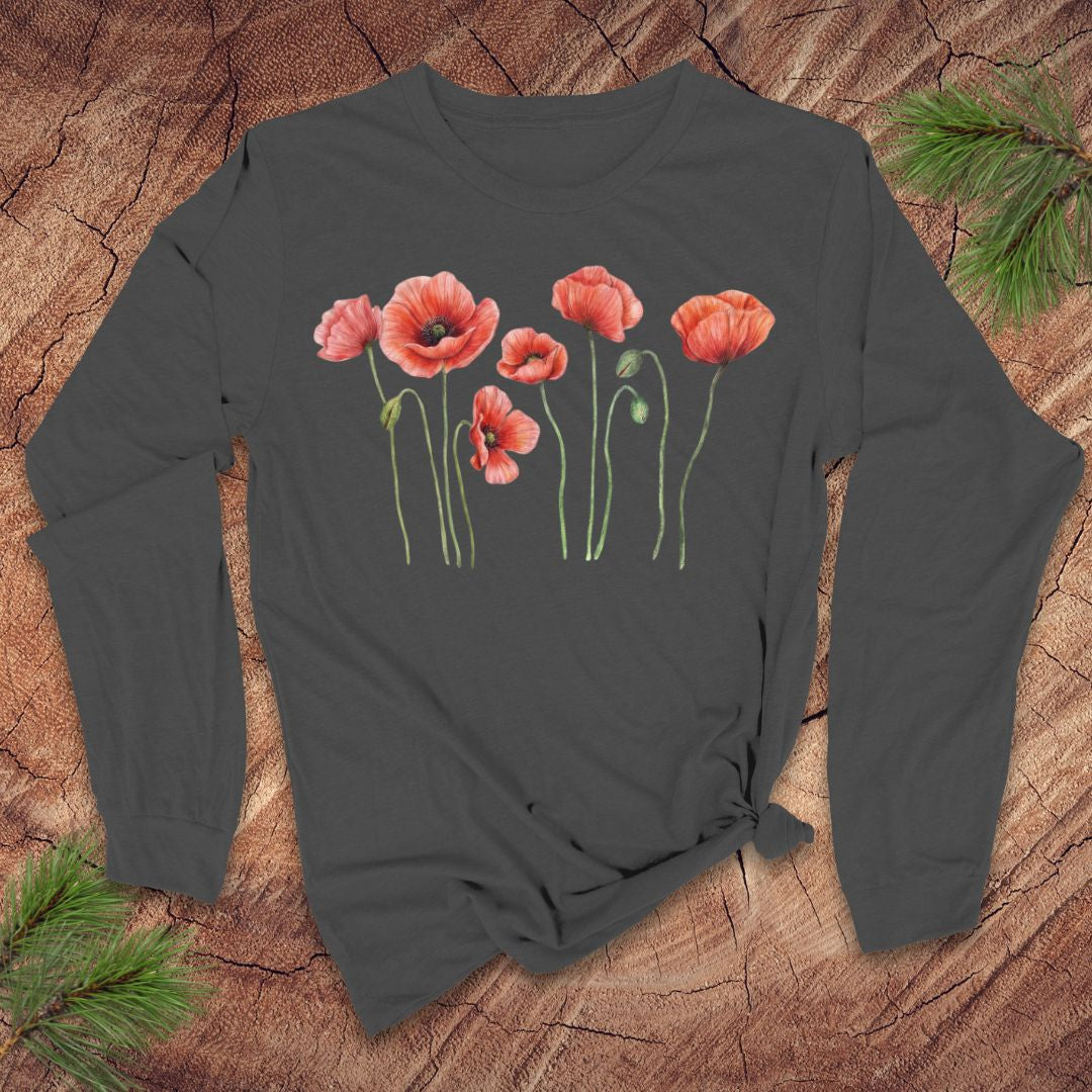 Light gray long-sleeve tshirt with pink poppies design on a wooden surface