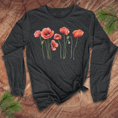 Dark gray long-sleeve tshirt with pink poppies design on a wooden surface