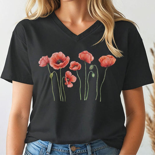 Person wearing a black v-neck t-shirt with red floral poppy design