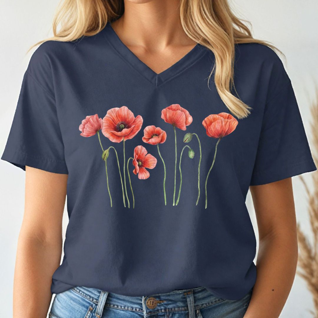 Navy blue v-neck t-shirt with red floral poppy design worn by a person