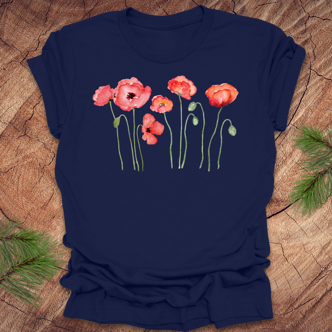 Navy blue t-shirt with red poppy design on a wooden surface