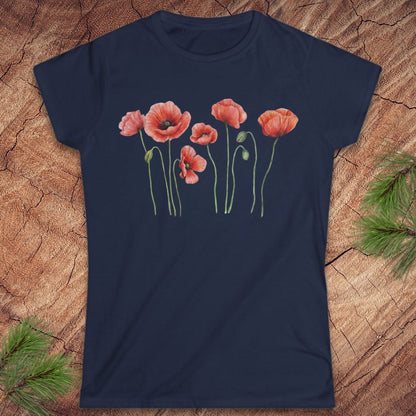 Navy blue t-shirt with red poppy flower design on a wooden surface