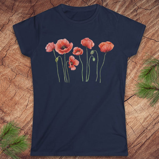 Navy blue t-shirt with red poppy flower design on a wooden surface