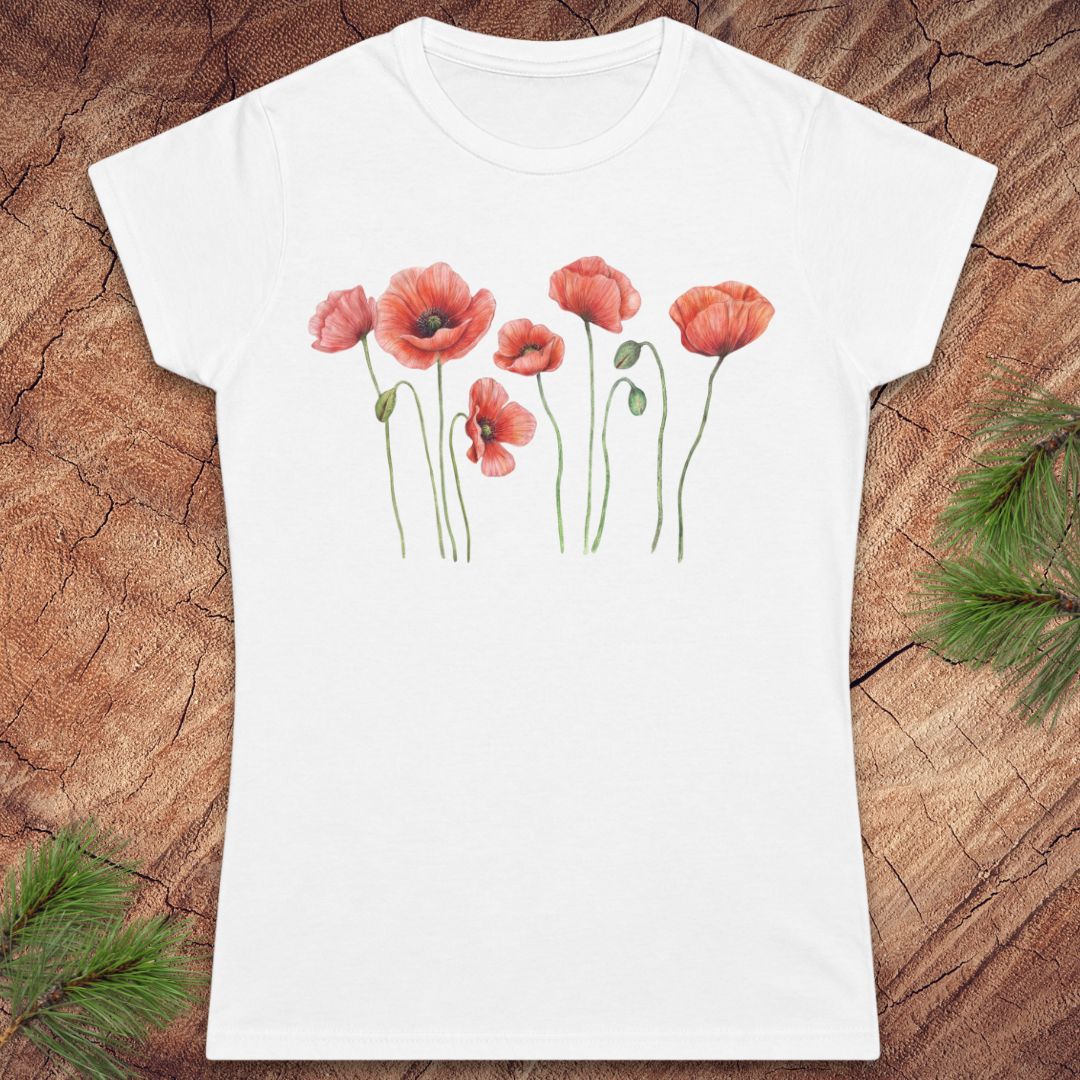 White t-shirt with red floral design on a wooden surface