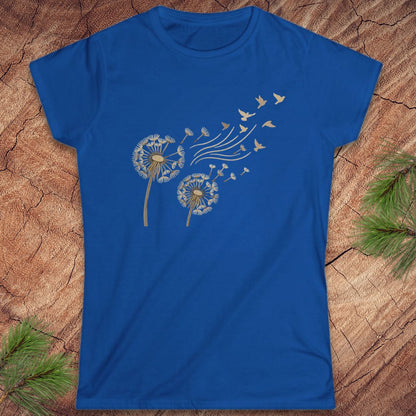 Blue t-shirt with a dandelion and birds on a wood background.