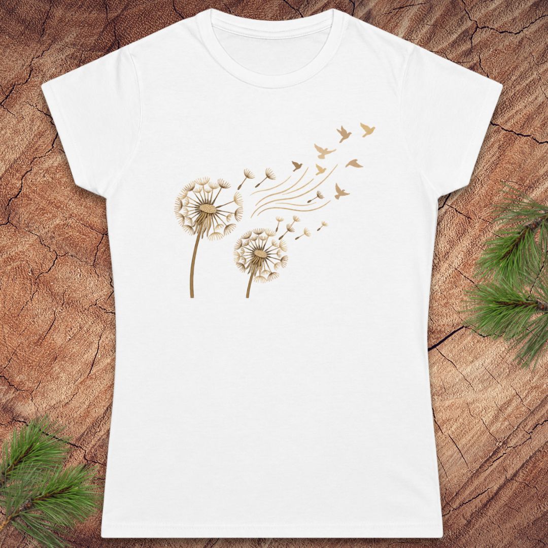 White t-shirt with a dandelion and birds on a wood background.