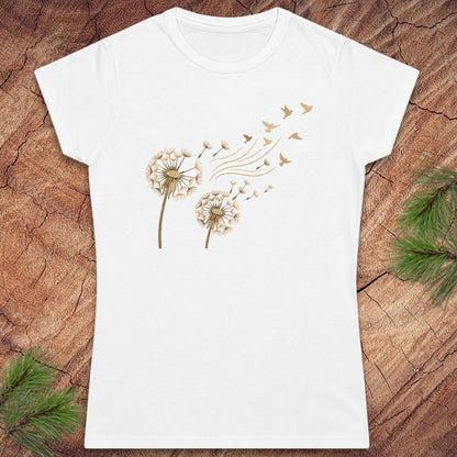 White t-shirt with a dandelion and birds on a wood background.