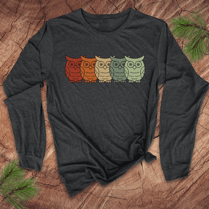 Dark gray long-sleeve shirt with colorful owl design on a wooden surface