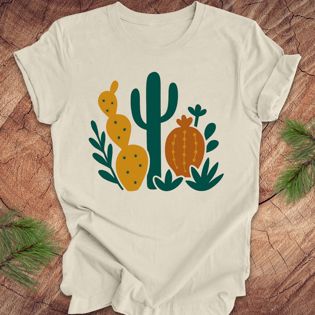 Beige t-shirt with cactus design on a wooden surface