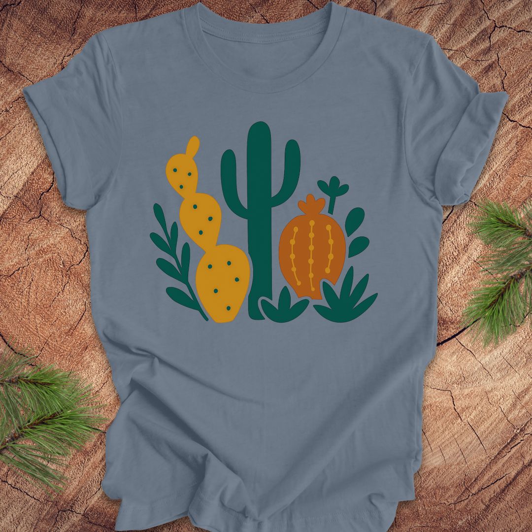 Blue t-shirt with cactus design on a wooden surface