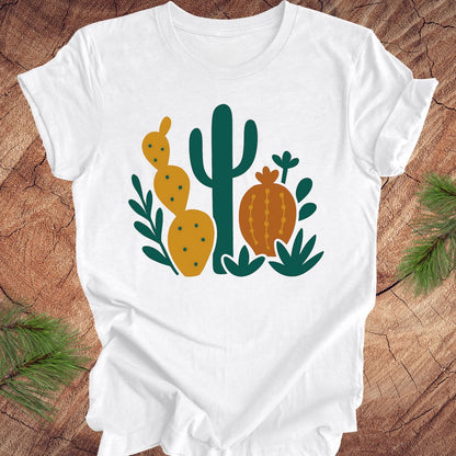 White t-shirt with cactus design on a wooden surface
