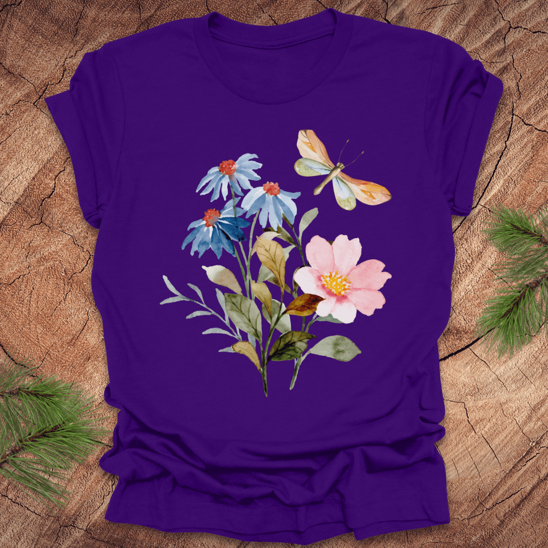 Purple t-shirt with floral design featuring flowers and a butterfly on a wooden surface.