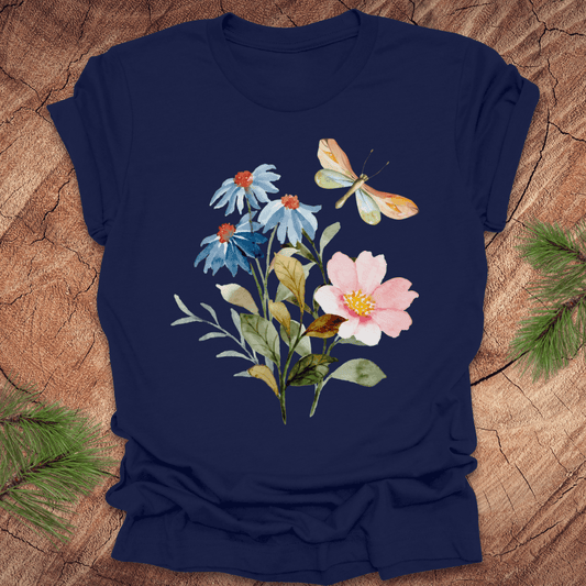 Navy blue t-shirt with floral design featuring flowers and a butterfly on a wooden surface.