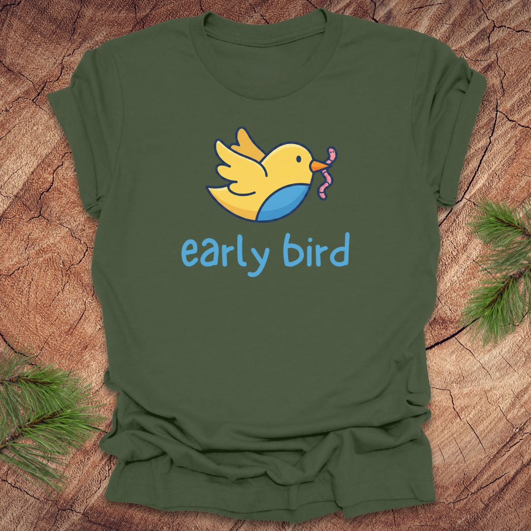 Green t-shirt with a yellow bird graphic and 'early bird' text on a wooden surface.
