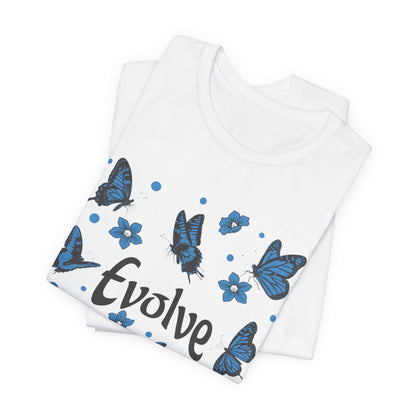 White folded tshirt with blue butterfly designs and 'Evolve' text on a white background