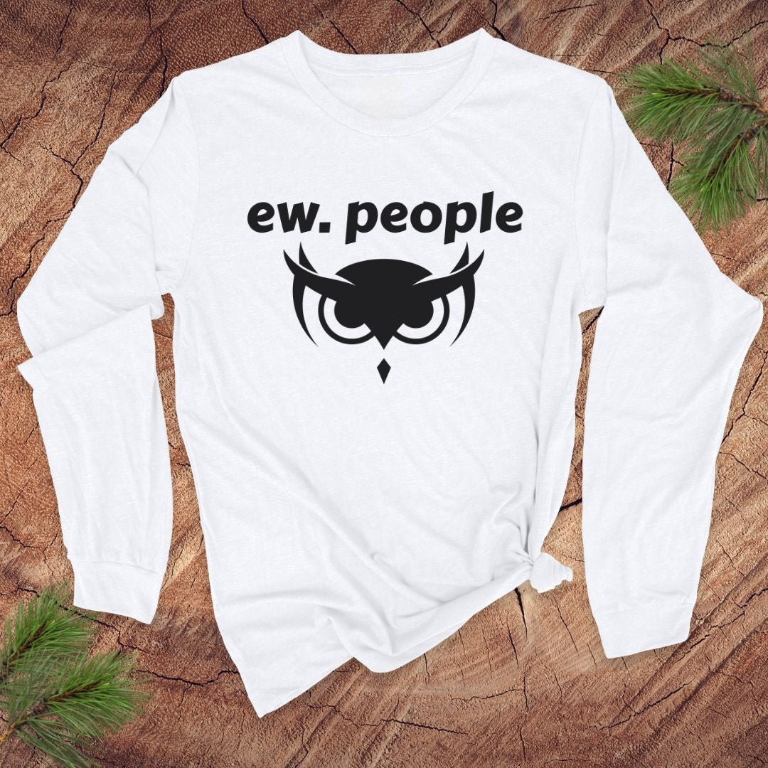 White long-sleeve shirt with 'ew. people' text and owl design on a wooden surface.