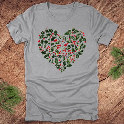 Gray t-shirt with a heart-shaped holly design on a wooden surface