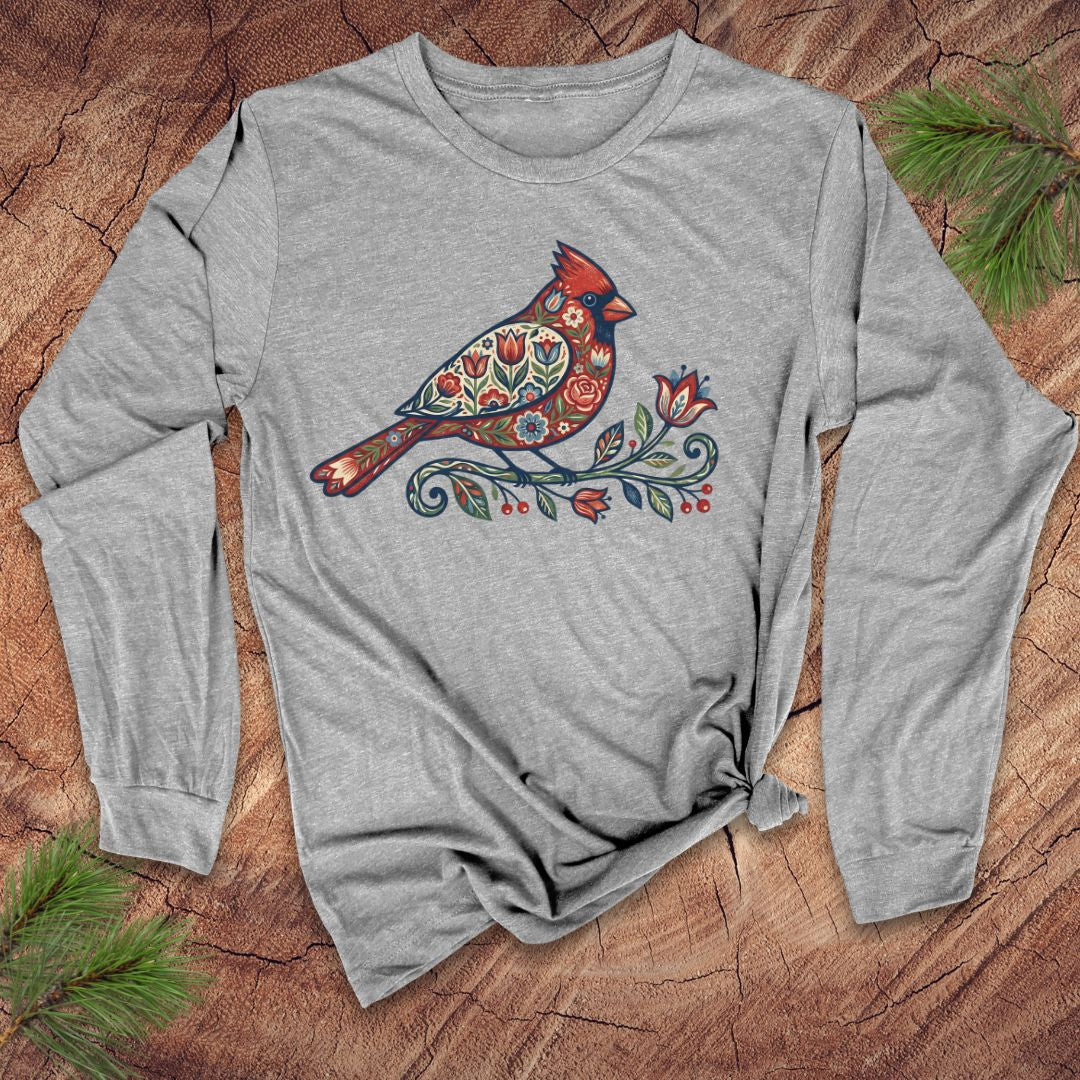 Gray long-sleeve shirt with a colorful cardinal design on a wooden surface.